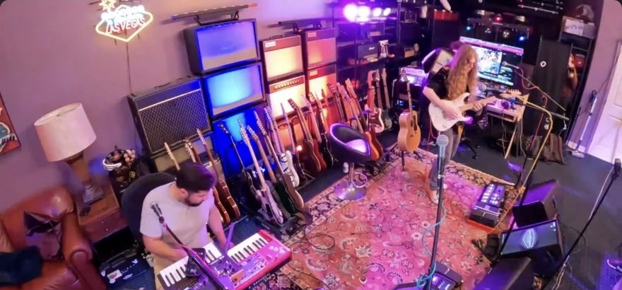 Musicians playing guitar and keyboards in the Jazz Odyssey live room.